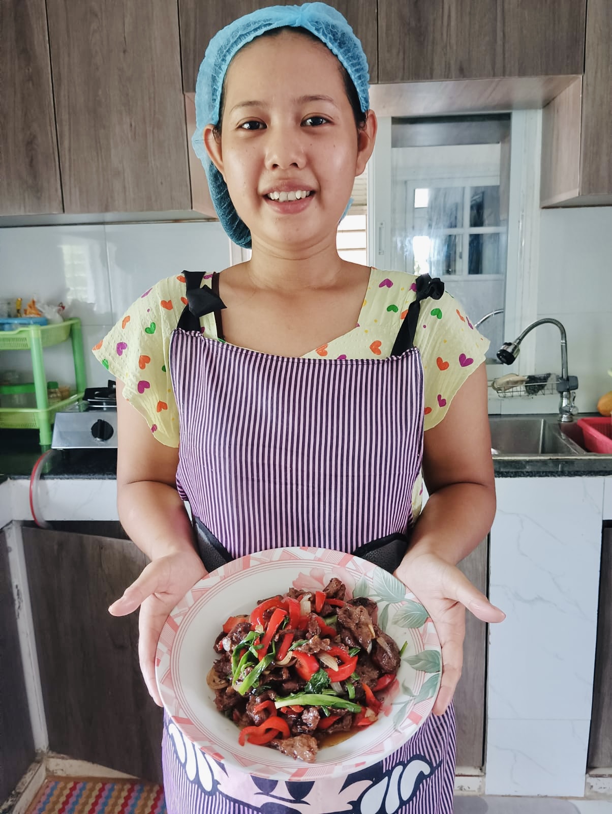 Pic of a helper with a delicious meat dish